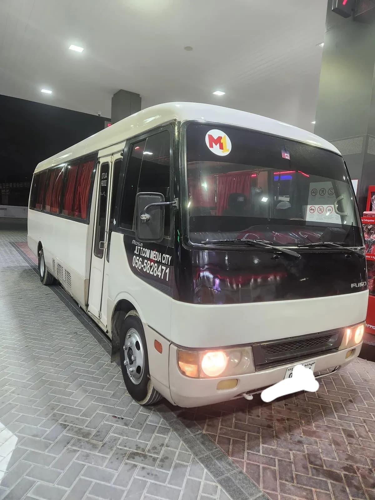 M1 CarLift Mitsubishi Fuso Rosa bus operating JLT Media City route from Sharjah